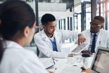 Teamwork, medical people and man with tablet in meeting for planning, treatment or opinion of...