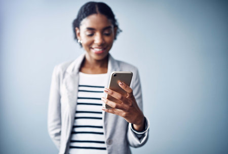 Business woman, phone and text for social media, internet and app on mobile in studio. Website,...