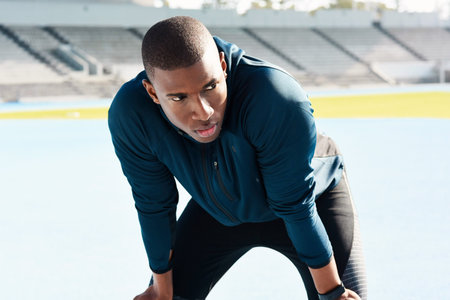 Fitness, running and tired with sports black man in stadium venue for competition or performance....