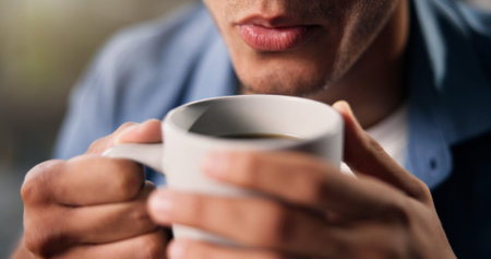 Blow, coffee and thinking with man on sofa in living room of home for weekend relax or wellness....
