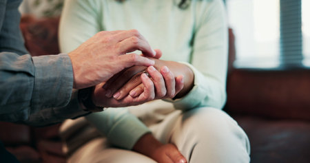 Therapy, holding hands and person with grief, stress and advice for counselling and mental health....