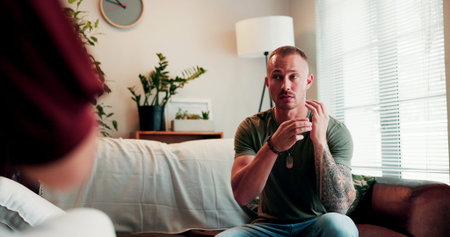 EFT tapping, therapy and man on sofa at session for healing, holistic or stress relief with peace. Anxiety, health and male patient with wellness coach for zen, relax or calm exercise in clinic.の写真素材