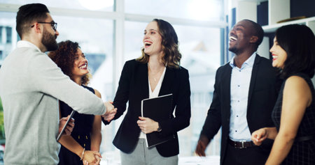 Happy, lawyers and business people with handshake in office for agreement, merger and partnership....