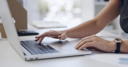 Typing, research and hands with laptop in business, financial analyst and risk assessment on...