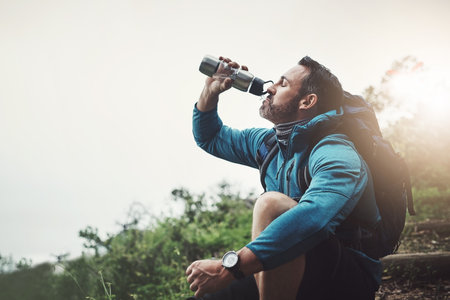 Backpack, man and drinking water for travel for outdoor with a hydration from adventure. Exercise, journey and fitness traveler with hiking and bottle on an eco friendly vacation with holidayの写真素材