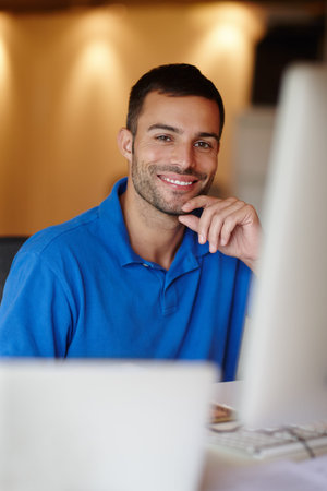 Businessman, desk and smile in portrait with computer in office with confidence for graphic...