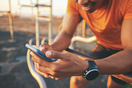 Outdoor, playground and hands with phone for fitness, check health stats and training equipment...