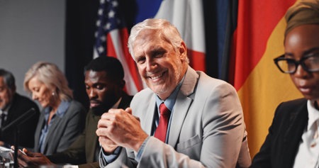 Press conference, politics and happy man with government panel or international delegation. Summit, people and portrait of mature politician with group for diplomacy, global forum or policy expo