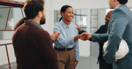 Handshake, applause and business people in office with contractor for renovation deal or agreement. Clapping, discussion and employee shaking hands with construction foreman for workplace remodeling.