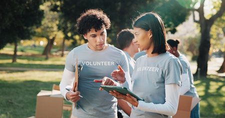 Volunteer, tablet and people with clipboard for talking, planning and grocery list for donation. Outdoor, tech and woman with team, checklist and inventory for food drive, aid and charity outreach