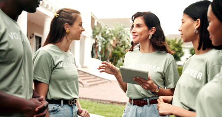 Volunteer, happy people or tablet outdoor for planning charity event, task delegation or instruction. NGO, mature team leader and tech for group coordination, fundraising briefing and digital roster