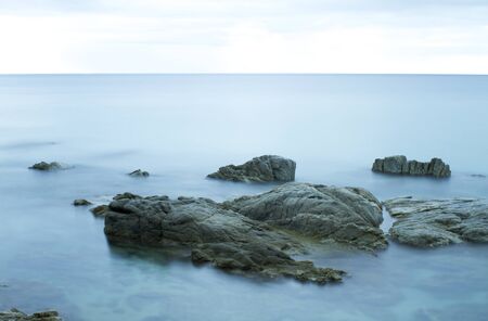 Beautiful rocky sea shore. Long exposure landscape. Costa Brava Spainの写真素材