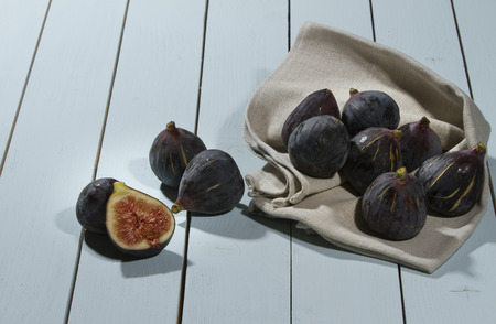fresh figs just collected on a wooden soft blue tableの写真素材