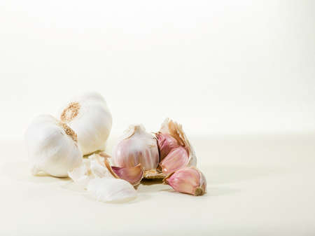 white garlics, one of them openedの写真素材