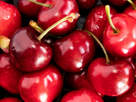 fresh cherries on a black stone, big size photo, high resolution