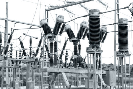 ceramic insulators on a high voltage installation, black and white photo