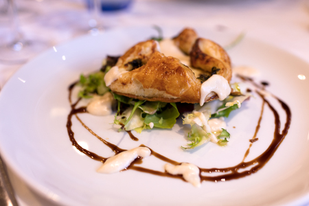 spinach cake on green salad, presented with gourmet styleの写真素材