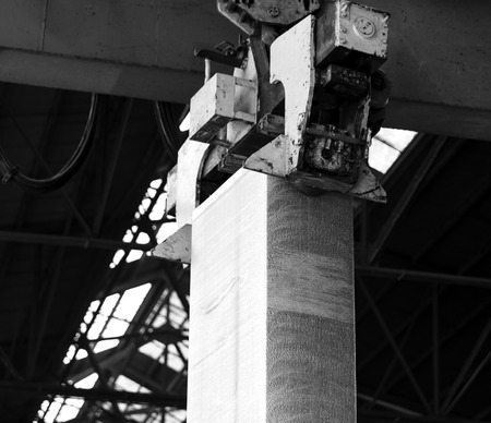 aluminum slab just melted and loading by a huge craneの写真素材