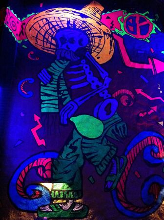 Neon picture wall of a Mexican mariachi in Cabo Wabo Cantina in Los Cabos Mexico の素材