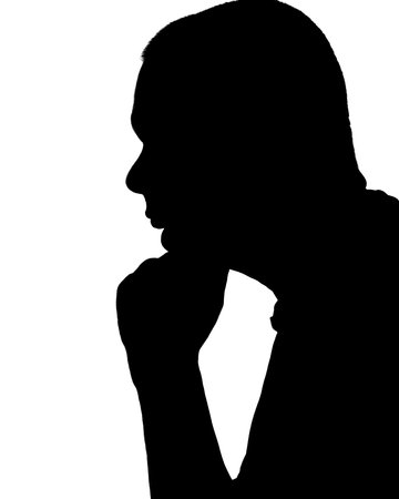 Silhouette of a young person with his hand resting on his chin against a white backgroundの写真素材