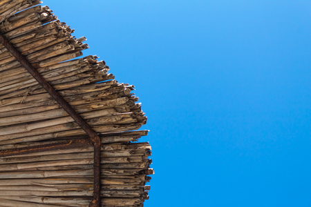 point of view under the straw umbrella and the blue skyの写真素材