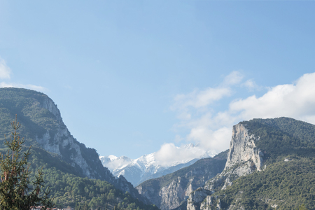 mount peak covered in snow and cloudsの写真素材