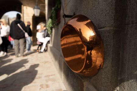 The copper pan in a pedestrian zone.の写真素材