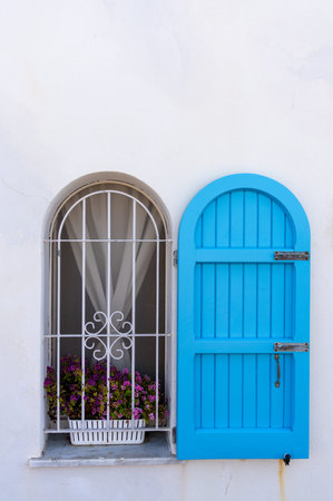 Beautiful blue door on white wall background, Greece, Europe.