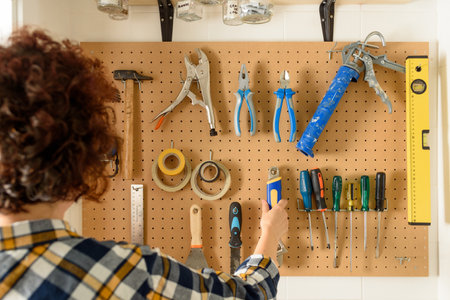 various construction tools hanging on the wall. High quality photo.の写真素材