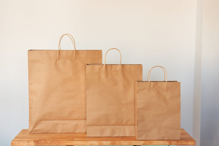 Three paper bags on isolated white background