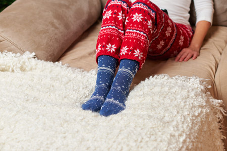 Person wearing Christmas socks and pajamas