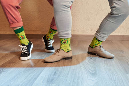 Feet of lindy hop dancers with avocado socksの写真素材