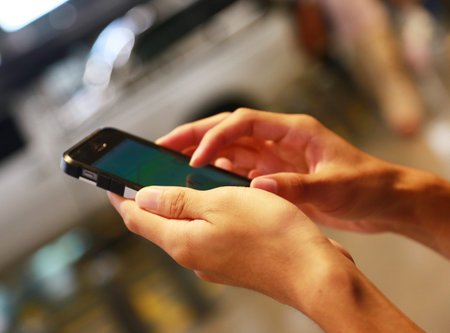 Man with smartphone, close-up