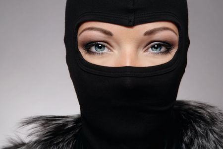 Head of woman with beautiful eyes in black maskの写真素材