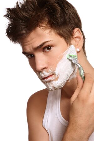 Portrait of young beautiful sexy man shavingの写真素材