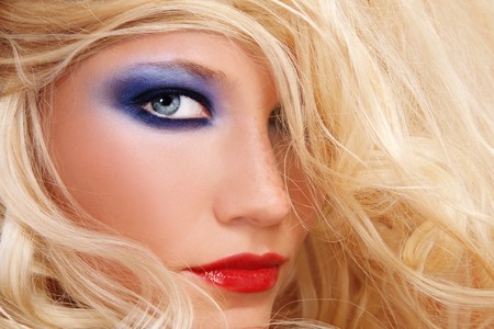 Close-up shot of young beautiful woman with long blond hair and stylish make-upの写真素材