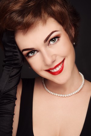 Portrait of young beautiful smiling woman with glamorous make-upの写真素材