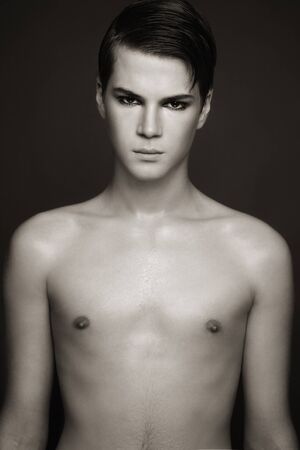 Duotone shot of young beautiful sexy man の写真素材