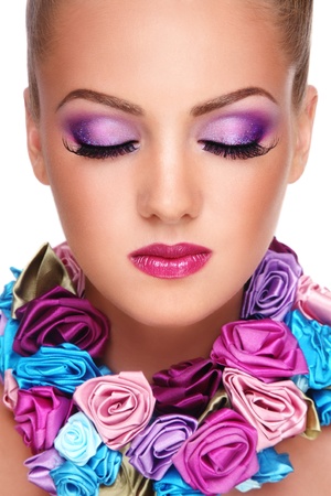 Close-up portrait of young beautiful blond girl with closed eyes and stylish violet make-up Close-up portrait of young beautiful blond girl with closed eyes and stylish violet make-up
