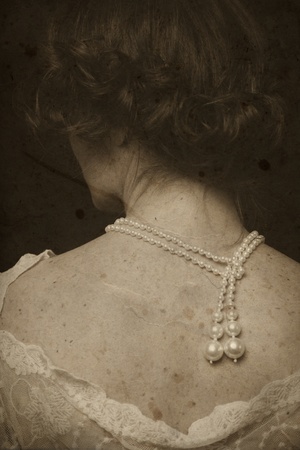 Vintage shot of woman's back on grainy damaged backgroundの写真素材