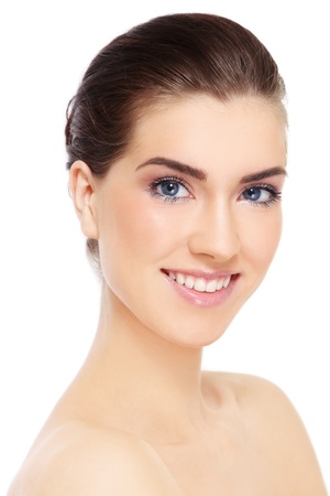 Portrait of young beautiful smiling healthy woman over white backgroundの写真素材