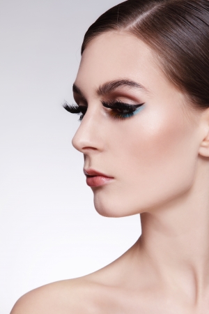 Portrait of young beautiful woman with cat eye make-up and fancy false eyelashesの写真素材