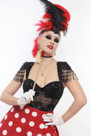 Pretty bourlesque girl in fancy costume with plumageの写真素材