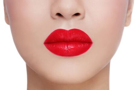Close-up shot of beautiful woman lips over white backgroundの写真素材
