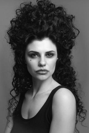 Black and white portrait of young beautiful woman with fancy vintage hairdoの写真素材