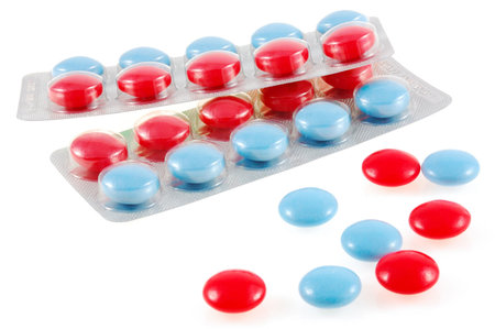 isolated red and blue tablets in boundle and spilledの写真素材