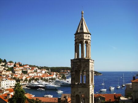View on the old town of city hvar in croatia behind the old stone churchの写真素材