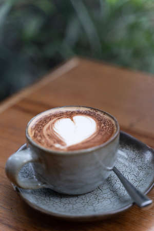 A cup of coffee with latte artの写真素材