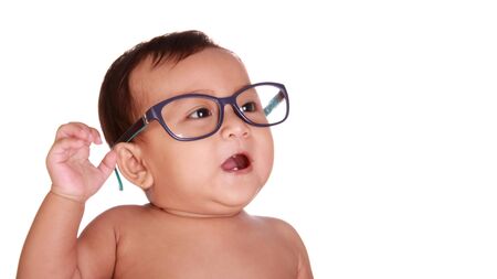 Happy cute baby wearing nerd glasses, close up face, isolated on white backgroundの写真素材