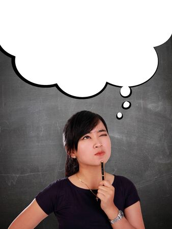 Imagination of young Asian woman. Copy space on white comic cloud for business / education conceptの写真素材